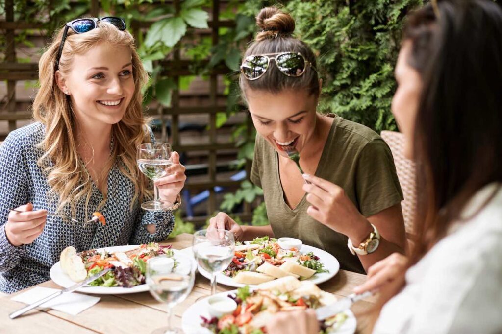 Advanced Body Foods Women Enjoying An Alkaline Meal For Optimized Health 
